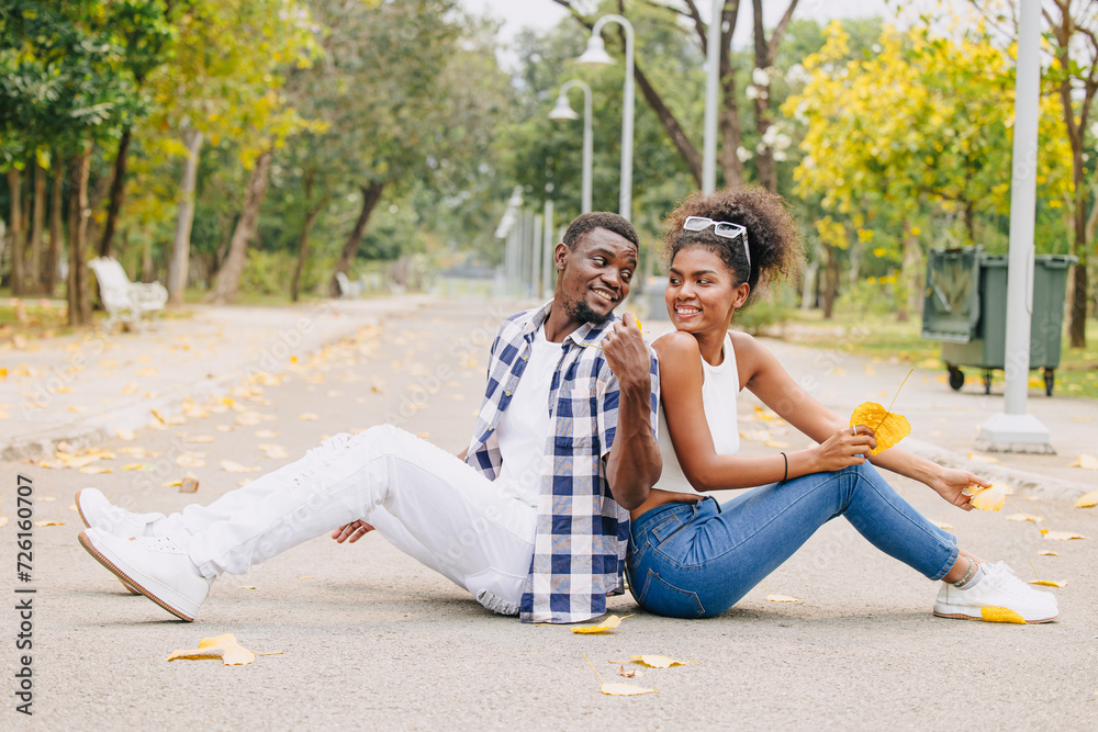 Date couple man and women valentine day. African black lover at park outdoors summer season vintage color tone Date couple man and women valentine day. African black lover at park outdoors summer season vintage color tone