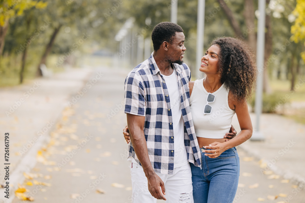 Date couple man and women valentine day. African black lover at park outdoors summer season vintage color tone