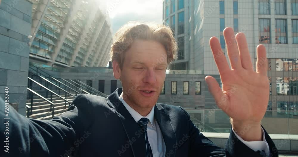 Suited blogger engages camera with intense emotions recording compelling video Blogger's face mirrors sentiment gestures accentuating impact. Nuance of blogger's emotional state is visible. Suited blogger engages camera with intense emotions recording compelling video Blogger's face mirrors sentiment gestures accentuating impact. Nuance of blogger's emotional state is visible.