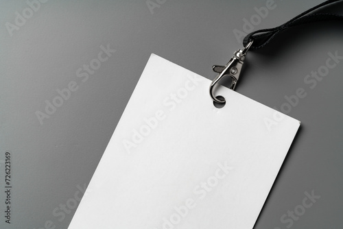 Blank nametag on gray background copy space