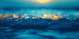 In the early dawn light on the open sea over ultramarine fluorescent sea wave in focus, beautiful bokeh of sag lights