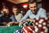 man with friends at a poker table, chips in the foreground