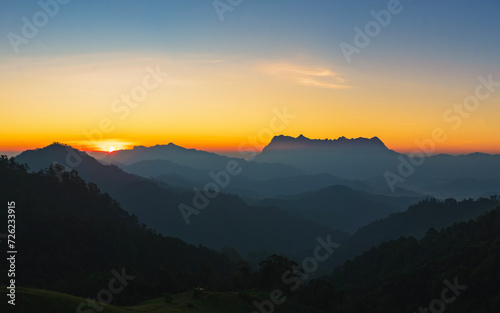 Beautiful Sunrise over Doi Luang Chiang Dao mountain at Hadubi camping viewpoint, Wiang Haeng district, Chiang Mai province, Thailand. © Songsak C