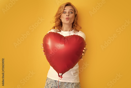 funny redhead woman with red heart balloon. charity and donation © Olena