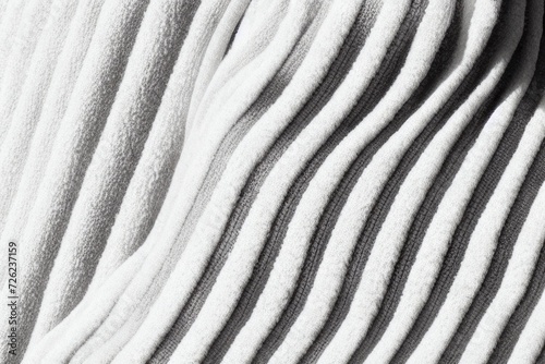 Closeup of fuzzy and soft black, gray and white fabric zebra striped pattern with beautiful soft light.