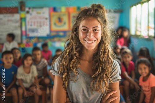 Wallpaper Mural Smiling female teacher in a classroom with diverse group of elementary students in the background. Torontodigital.ca