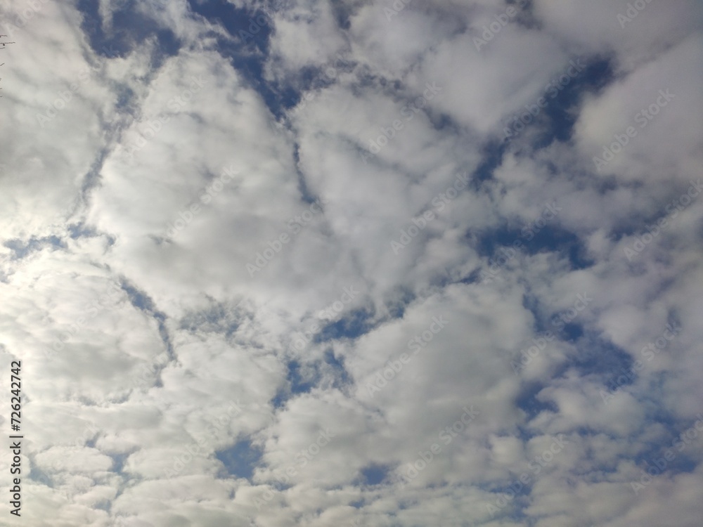 white clouds in a clear sky. white clouds in a clear sky.