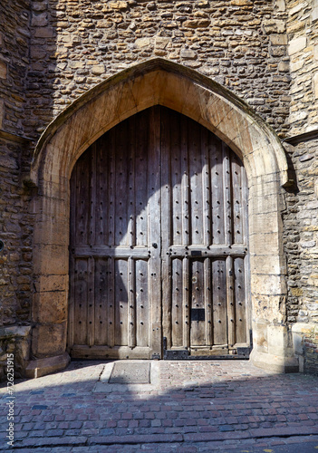 Huge studded doors to the Trinity’s Great Court. University of Cambridge, England