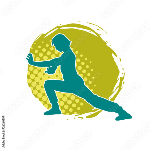 Silhouette of a man in oriental martial art pose. Silhouette of a male in martial art move.
