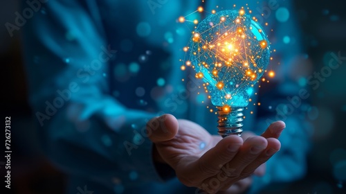 Person holding a lightbulb with glowing light suitable for creativity, ideas, innovation, innovation, energy, solution, inspiration, brainstorming, and innovation concept.