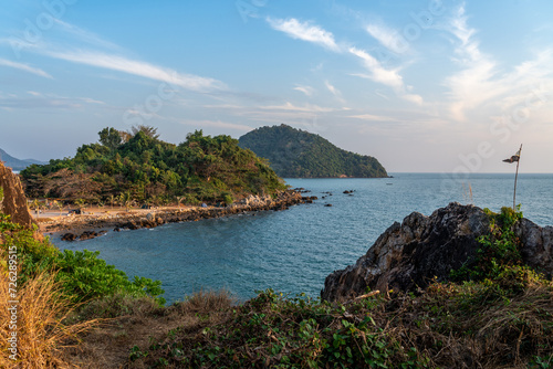 Beautiful view of evening sunset at the Noen Nangphaya view point looking out to the ocean and distant islands in Chonburi, Thailand photo