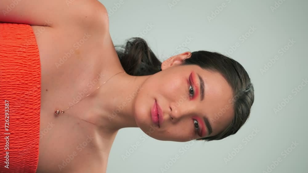 Vertical portrait of a young model with long black hair and bright makeup Vertical portrait of a young model with long black hair and bright makeup