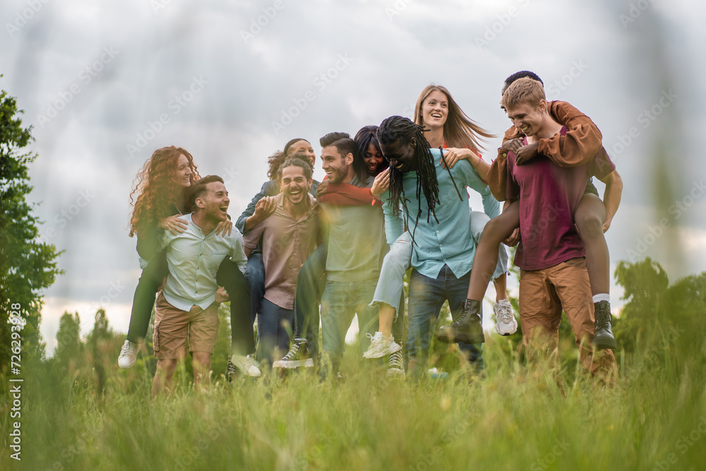 Joyful Togetherness: Friends Piggyback in Nature Joyful Togetherness: Friends Piggyback in Nature