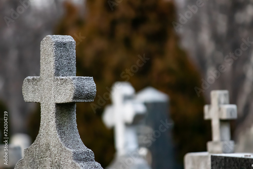 Marble and stone crosses in city graveyard, respect for dead's, rest in peace