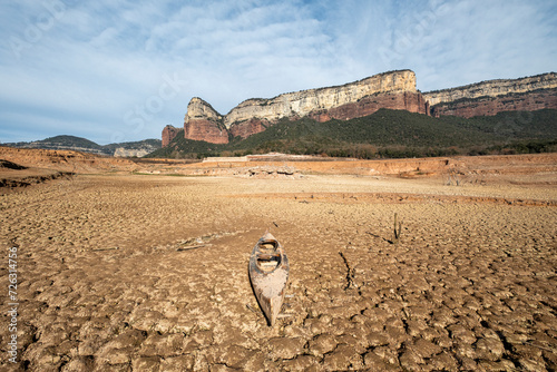 Kayak stranded on the dry land of the Sau reservoir, Panta de Sau, due to Catalonia's biggest drought in history