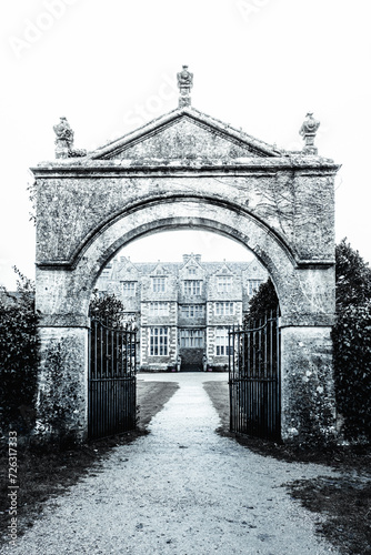 The Gates & Drive Of An English Country Mansion