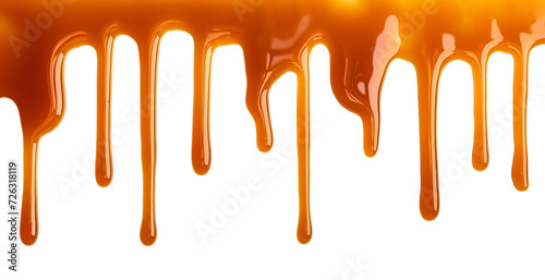 Dripping Melted caramel sauce drops isolated on transparent background photo