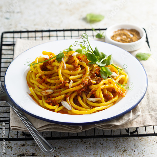 Pasta with red pesto and almond