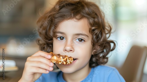 Preteen enjoying waffle fries in a restaurant with blurred background and space for text