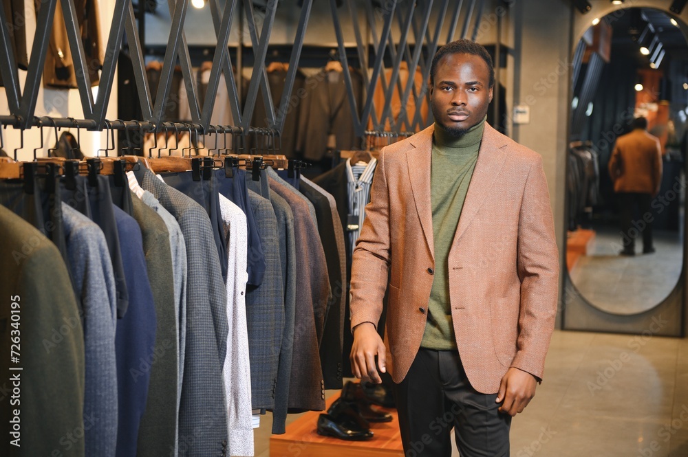 African businessman in elegant classic suit in a premium men's clothing store