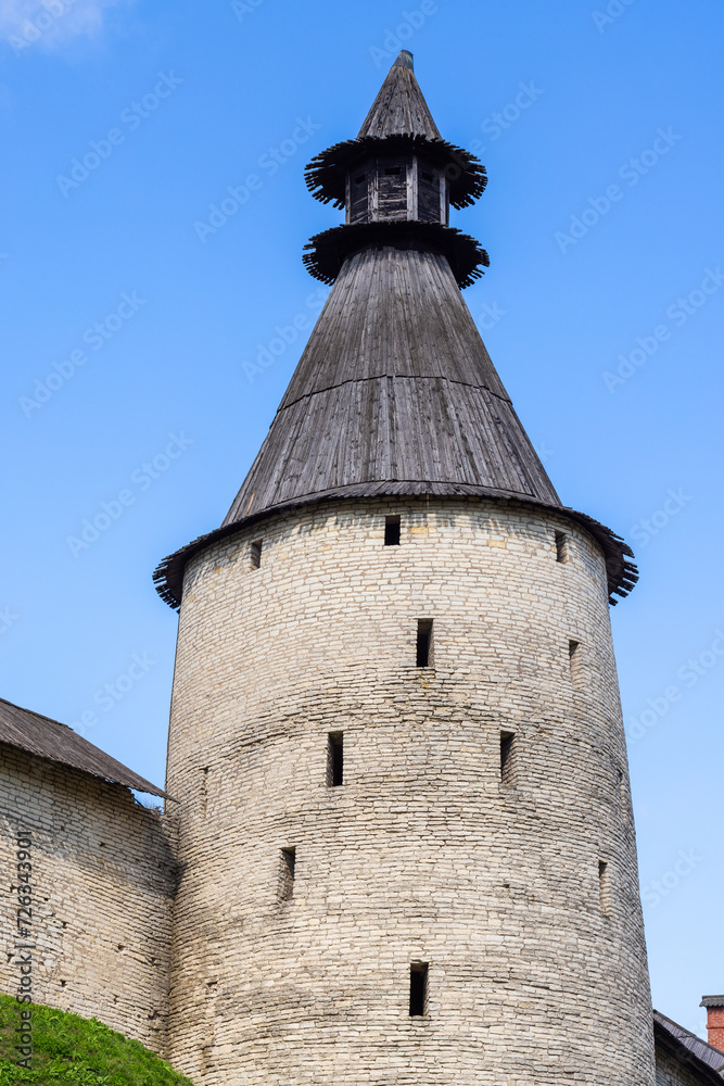 Stone tower and wall of the Kremlin of Pskov, Russia. Ancient fortress