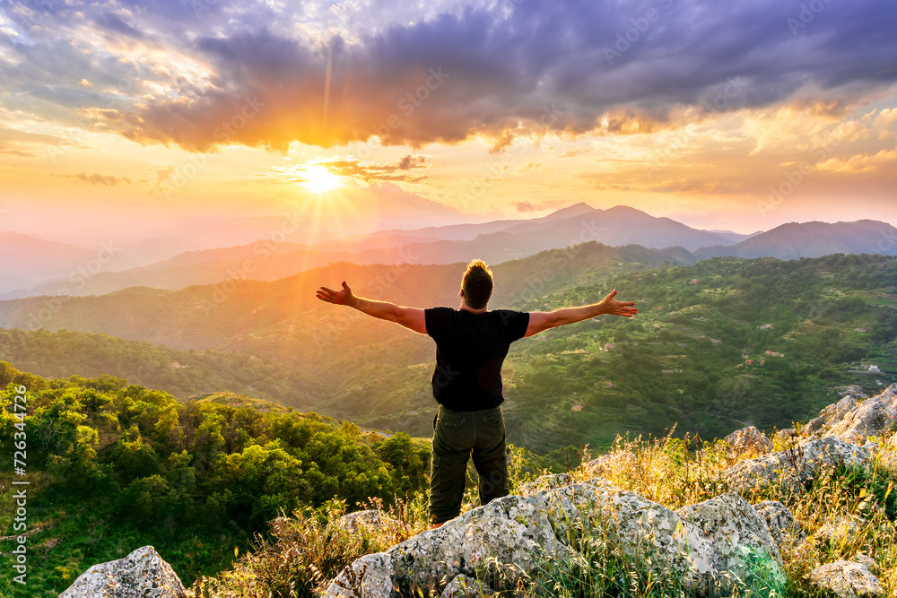 happy man watching amazing highland evening sunset, person delight with nature landscape happy man watching amazing highland evening sunset, person delight with nature landscape