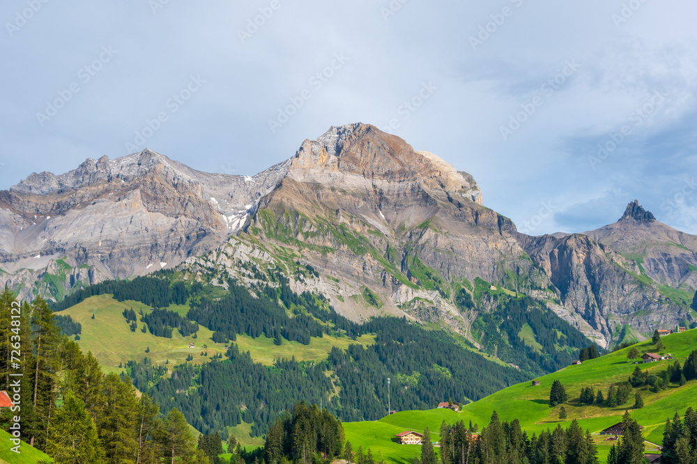 Picturesque summer landscape of the Swiss Alps. Lohner Mountains above the resort village of Adelboden, Canton of Bern, Switzerland.