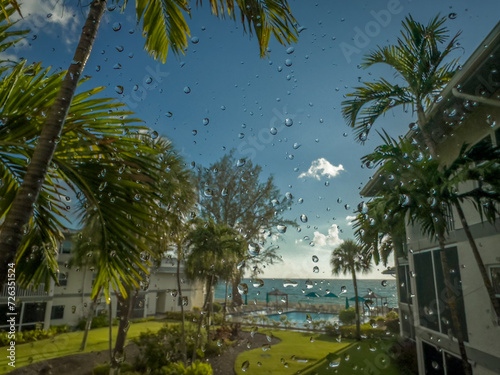 Grand Cayman  Cayman Islands  May 25th 2023  view of rain drops on a window facing the Caribbean Sea