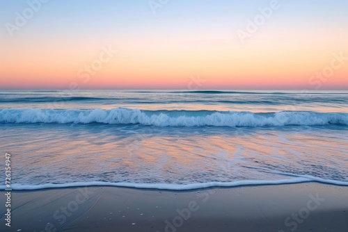 A serene beach scene at sunrise, with calm waves and a clear sky, reflecting tranquility and renewal.