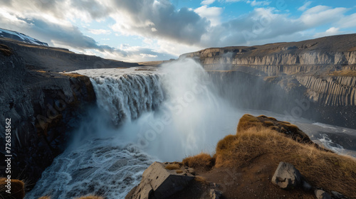 A powerful thunderous waterfall plunging into a deep canyon showcasing natures force.