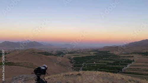 Photography experience in mountain highland panoramic landscape view of wide horizon blue sky line in mountain region in Esfahan the garden orchard field green hay bale fruit tree a colorful twilight photo