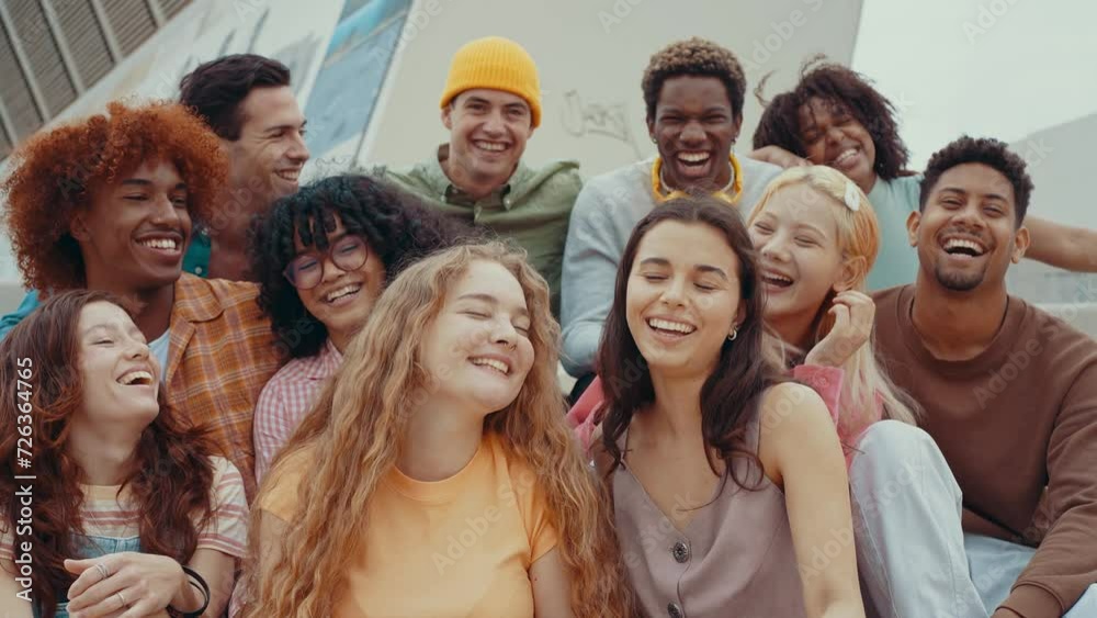 Multiethnic group of teenagers hanging out in the city center. Concepts about campus university students, friendship, and generation z Multiethnic group of teenagers hanging out in the city center. Concepts about campus university students, friendship, and generation z
