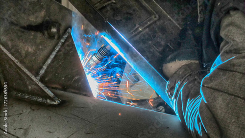 Welding radiation produced by a welder doing argon welding
