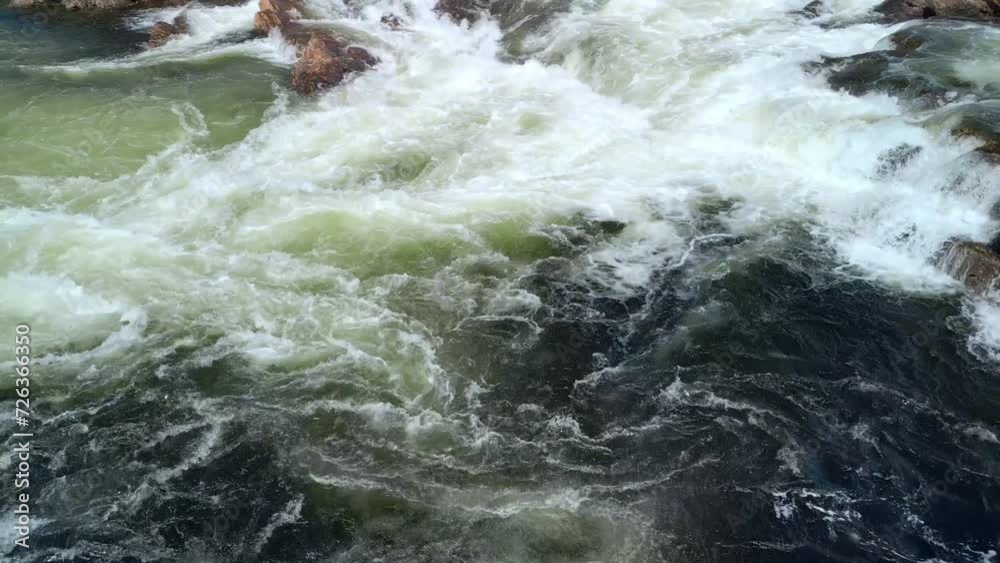 A drone flies low and back over the Namsen River, Norway, capturing the white cascades before ascending to reveal a panoramic view of the landscape A drone flies low and back over the Namsen River, Norway, capturing the white cascades before ascending to reveal a panoramic view of the landscape