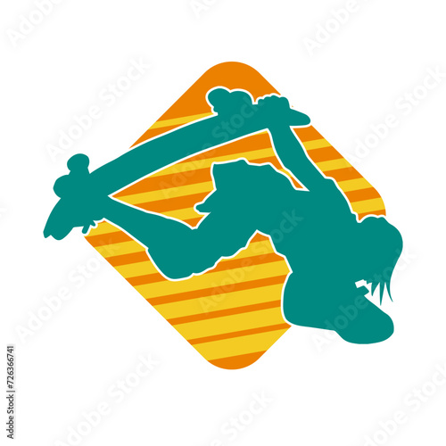 Silhouette of a male in action pose on skateboard. Silhouette of an urban boy on skateboard.