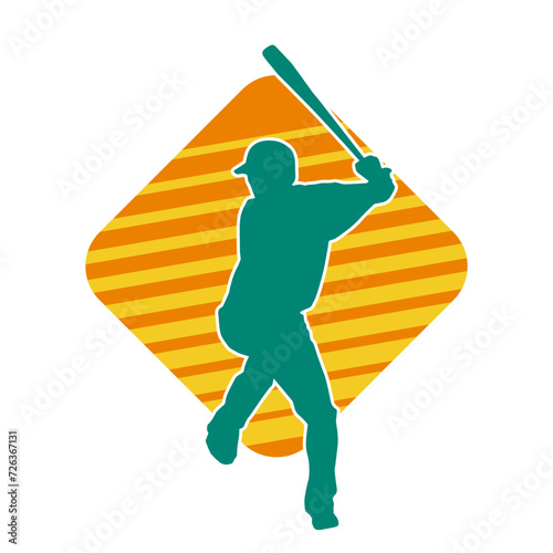 Silhouette of a male baseball batter player in action pose. Silhouette of a man athlete playing baseball sport as a batter.