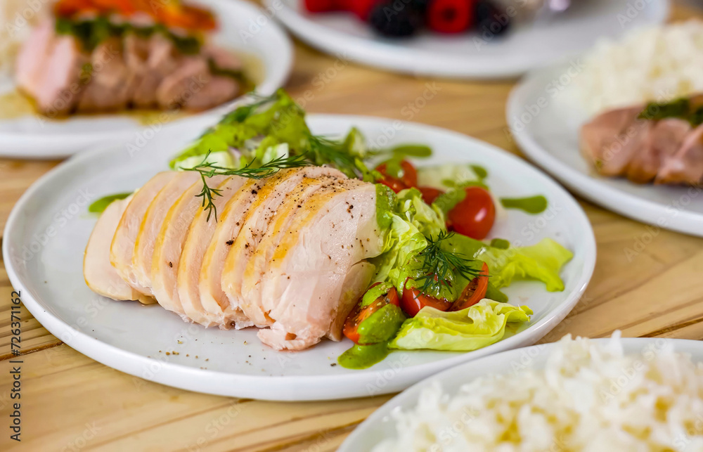 Healthy balanced diet delicious plates with vegetables, chicken. Homemade meal with chicken for menu, advert or package, close up selective focus Healthy balanced diet delicious plates with vegetables, chicken. Homemade meal with chicken for menu, advert or package, close up selective focus