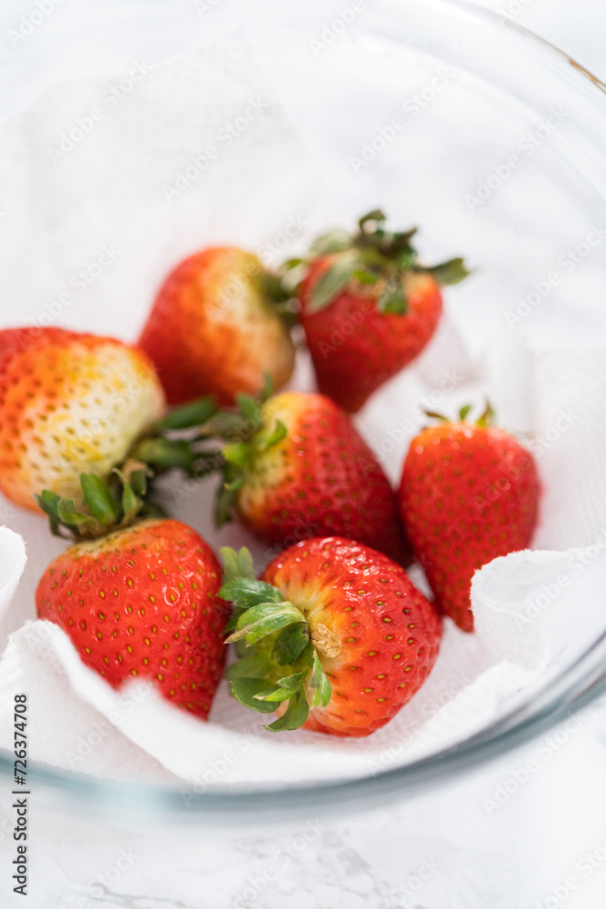 Washed and Dried Strawberries Neatly Stored in a Glass Bowl