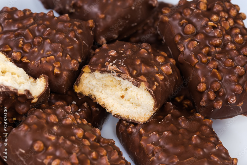 Cookies with rice balls and milk chocolate coating close-up Cookies with rice balls and milk chocolate coating close-up