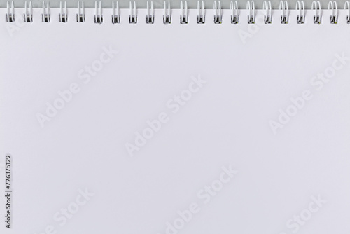 Photography Blank white sheet of exercise book with wire spiral binding