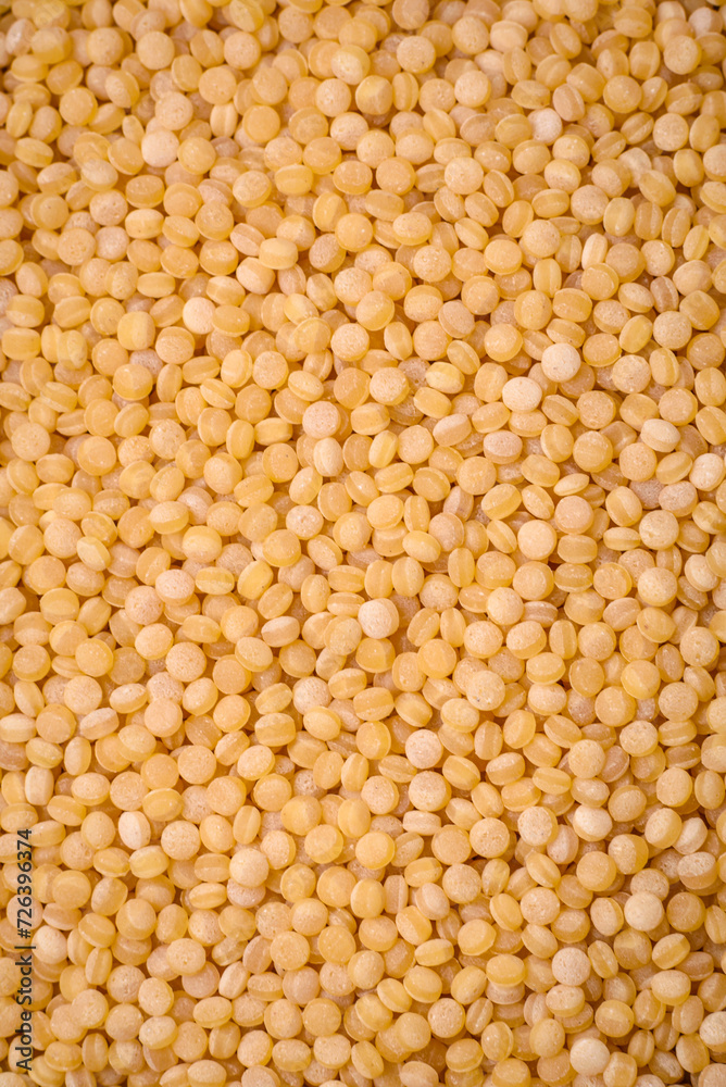 Ptitim wheat porridge grains on a dark concrete background Ptitim wheat porridge grains on a dark concrete background