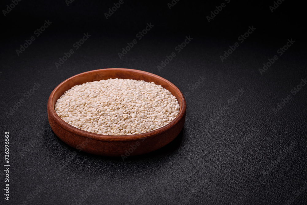 Large grains of uncooked white rice in a ceramic bowl Large grains of uncooked white rice in a ceramic bowl