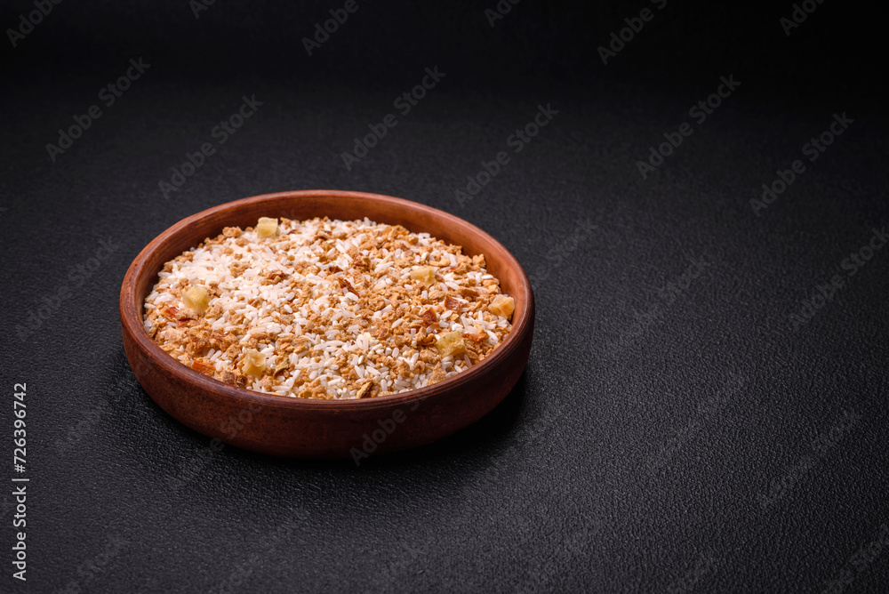 Large grains of uncooked white rice in a ceramic bowl Large grains of uncooked white rice in a ceramic bowl
