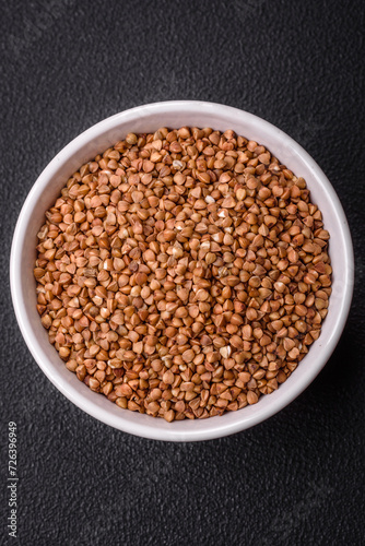 Large grains of raw buckwheat porridge are brown in color