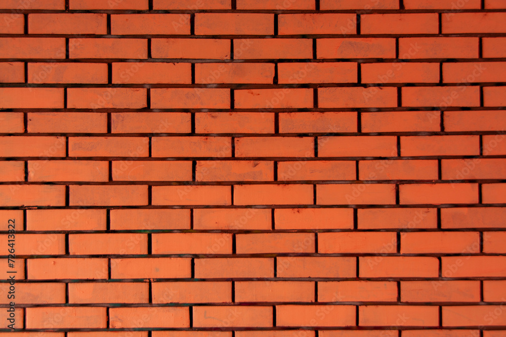 Fototapeta premium Orange red horizontal brick wall. Old textured surface background or cover element. Web banner.