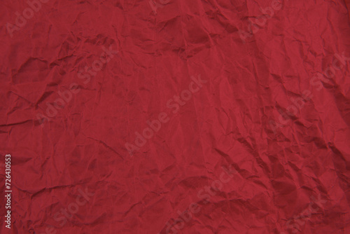 Red crumpled paper texture pattern. Rough grunge old blank.
