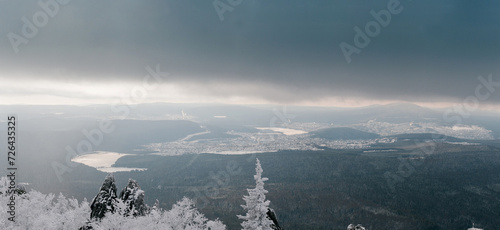 Ural mountains in winter. Wonderful wintry landscape at sunny day. Amazing view on snow covered mountains and white spruces.
