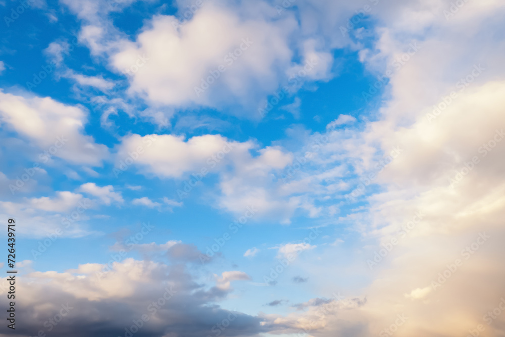 Natural background blue sky with light clouds in sunlight Natural background blue sky with light clouds in sunlight