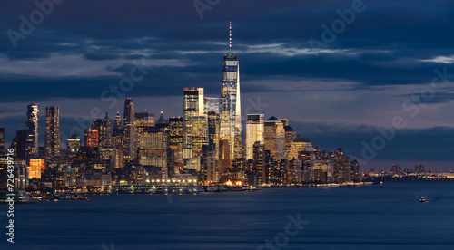View of New York City Financial District skyscrapers at twilight with Hudson River. Lower Manhattan with World Trade Center © Francois Roux