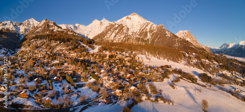Sunset on Chaillol ski resort in Ecrins National Park (Champsaur region) in winter. Mountain aerial view in Hautes-Alpes (Alps), France